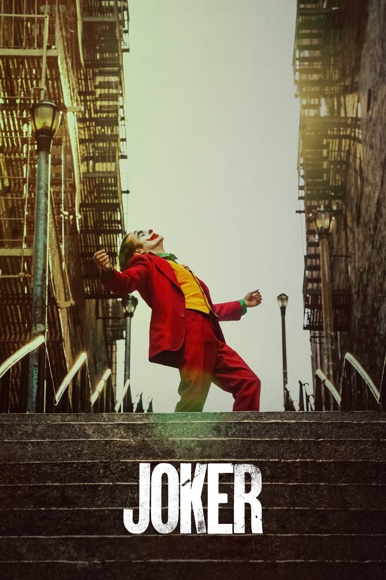 Joaquin Phoenix as Arthur Fleck in Joker, smiling disturbingly with a single tear running down his clown makeup
